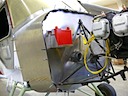 Battery mounted to firewall