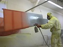 Applying Poly-Spray (UV protection)