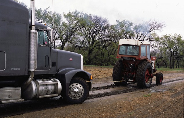 The truck arrives and is stuck in the mud